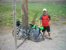 The author, Travis Poppe, by his touring bike.