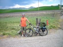 Fellow cyclist and friend, Korey Pelton, beside his mountain bike.