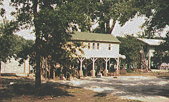 Houses on stilts on river.